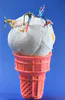 A staged photographic print of mini figures skiiing down ice cream in a cone by New Zealand artist Adam Popovic, available at The Little Gallery Whangamata